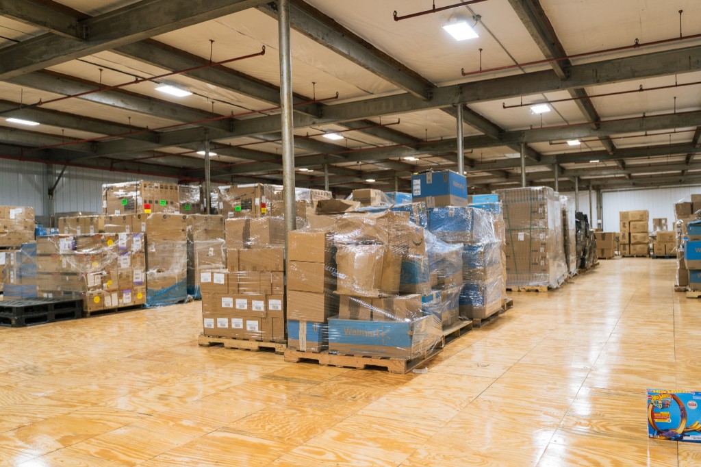Wide view of aisles and palletized inventory in the US fulfillment center